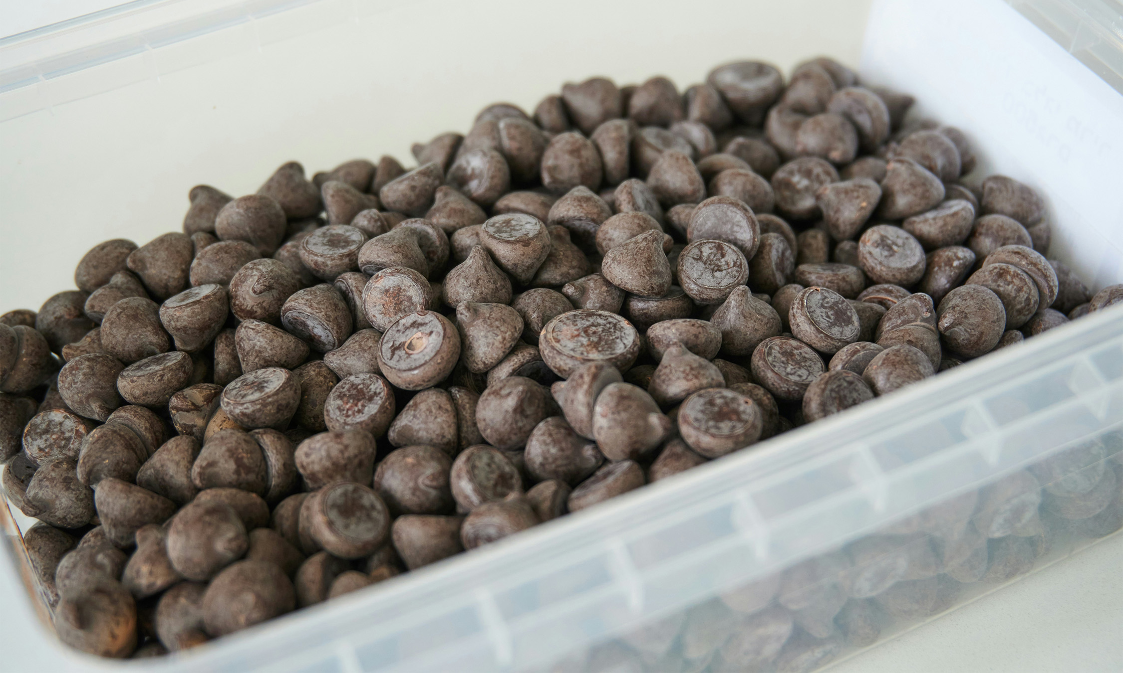 A container filled with chocolate chips.